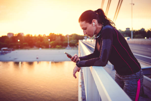 istock Fitness woman using smart phone 815991604