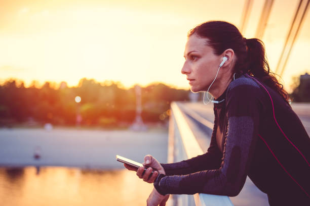 istock Fitness woman using smart phone 815991616