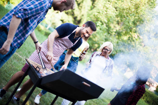 istock Friends preparing food on grill 816010030