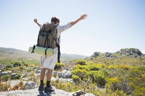 istock Hiker standing at the summit with arms outstretched 816017810