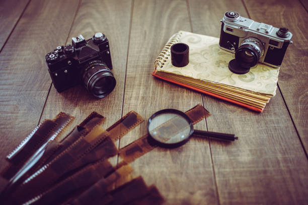 istock Vintage camera on wooden table 816032892