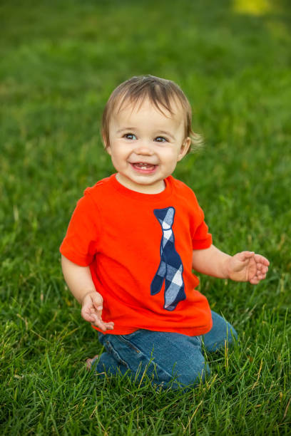 istock One Year Old Boy Playing Outside in Grass 816041958