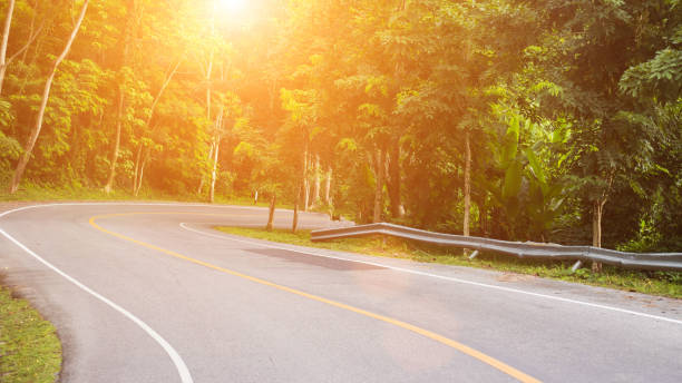 istock Sun in horizon over asphalt road 816042246
