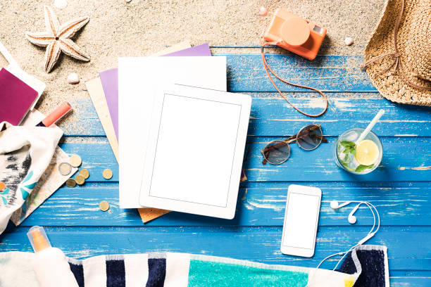 istock White blank magazine on blue wooden platform with summer accessories 816046480