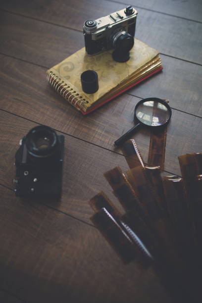 istock Vintage photo camera on a wooden table 816058094