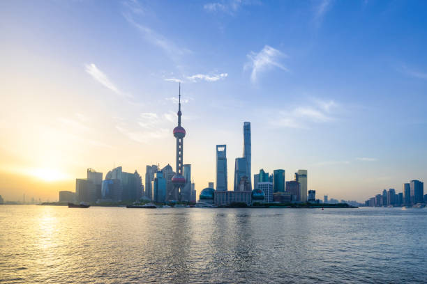istock modern buildings near river at sunrise 816062636