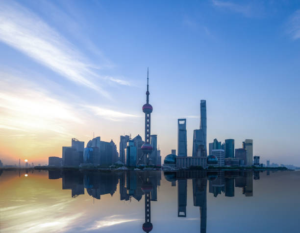istock modern buildings near river at sunrise 816062638