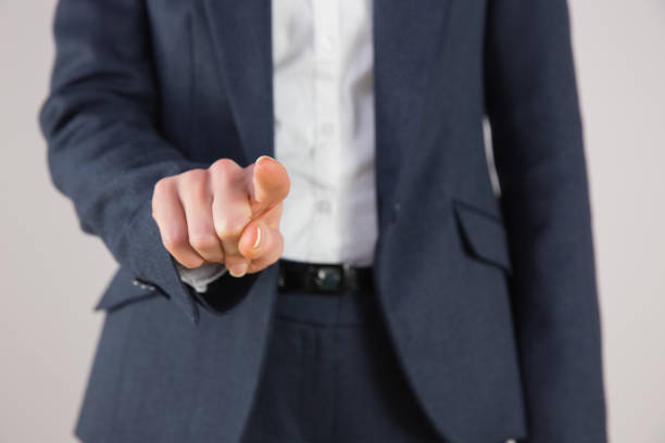 istock Businesswoman in suit pointing finger 816074122