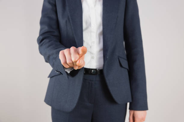 istock Businesswoman in suit pointing finger 816074176