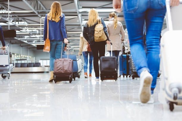 istock Passengers walking in the airport corridor 816086296