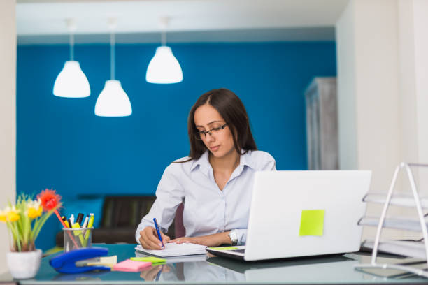 istock Businesswoman taking a note in her office 816088952