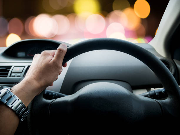 istock Driving a car at night, bokeh color 816091298