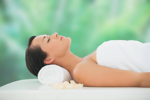 istock Beautiful brunette relaxing on massage table 816096652