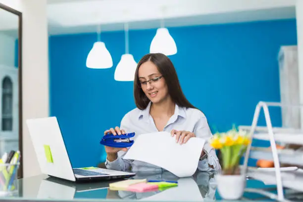 Young businesswoman working in her office