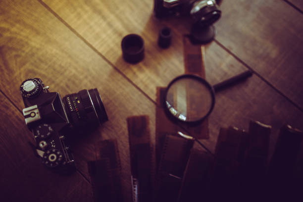 istock Vintage photo camera on a wooden table 816102112
