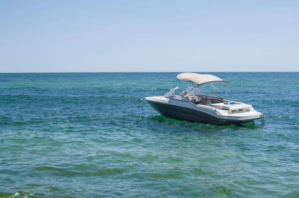 istock Anchored motor boot at sea 816107478