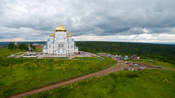 istock White monastery building with golden domes on hill 816127252
