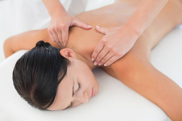 istock Beautiful brunette enjoying a back massage 816129600