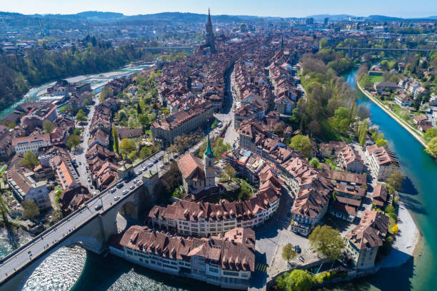 Aerial view of Bern old town Aerial view of the Bern old town with the Aare river flowing around the town on a sunny day, Bern, Switzerland. alpine climate photos stock pictures, royalty-free photos & images