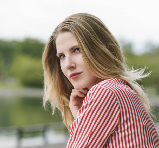 istock Outdoors portrait of young woman. 816149628