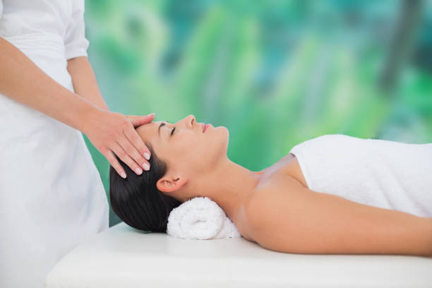 istock Beautiful brunette enjoying a head massage 816159350
