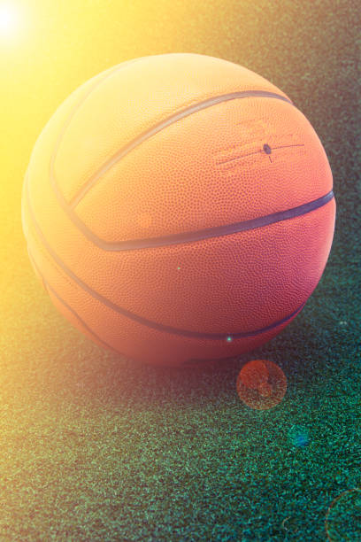 istock basketball on green grass background 816162560