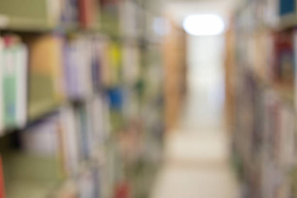 istock books on bookshelf in library, abstract blur defocused background 816197780
