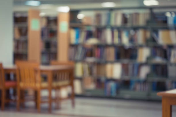 istock bookshelf and table desk education, abstract blur defocused background 816197932