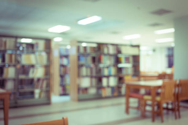 istock bookshelf and table desk, education abstract blur defocused background 816197952