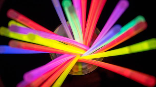 istock Multicolor fluorescent tubes on a black background 816198094