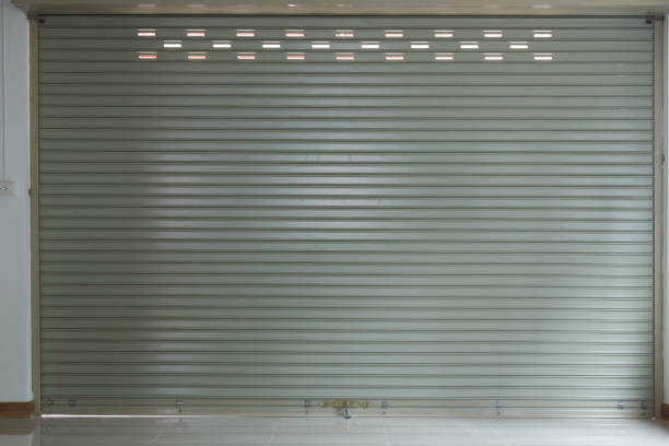 istock steel metal door, roller shutter door in warehouse building 816200730