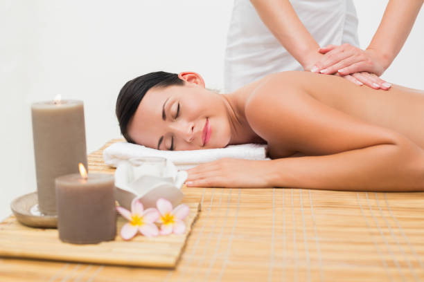 istock Beautiful brunette enjoying a back massage 816201350