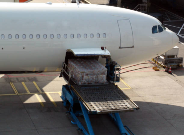istock Loading Of Goods Into Passenger Airplane At Airport 816207844