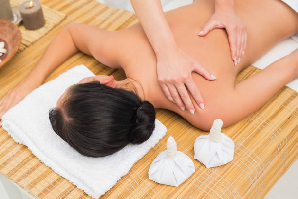 istock Woman enjoying a herbal compress massage 816210468