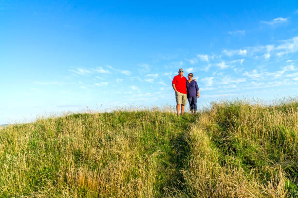 istock Senior couple standing on countryside path 816210472
