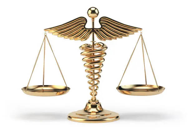 Photo of Medical caduceus symbol as scales. Concept of medicine and justice.