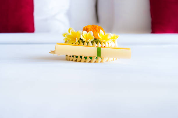 istock Hotel room with bed and flower arrangement 816233834