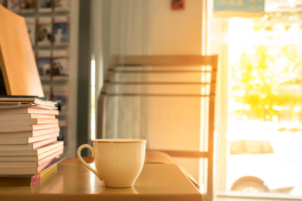istock Cup of coffee with book in office 816236970
