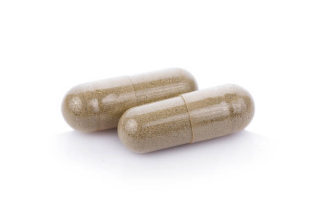 istock pills capsules isolated on white background 816242900