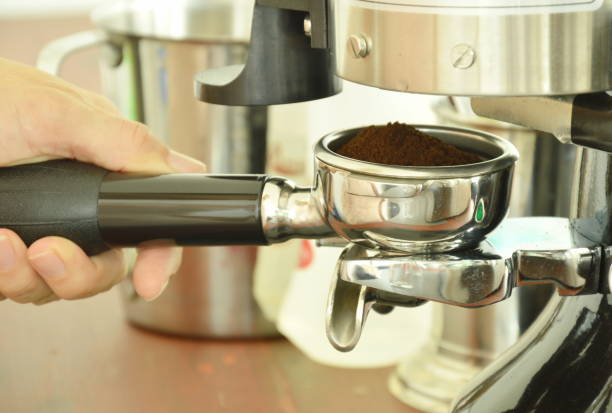 istock hand holding coffee powder shot in stainless cup 816249258