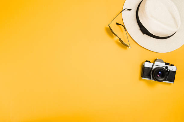 istock Accessories for travel top view yellow background with copy space 816249408