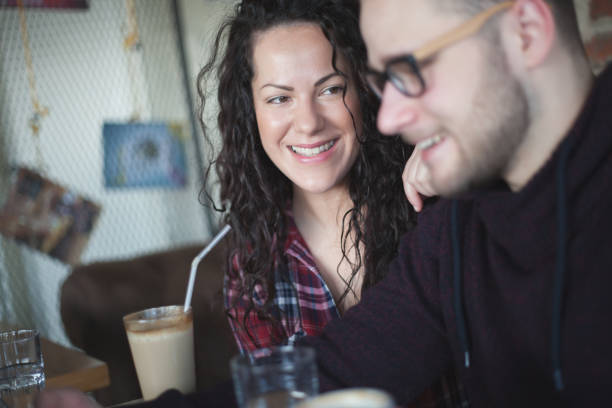 istock Love couple drinking coffee in cafe bar 816254194