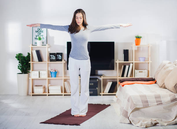istock Fit woman doing yoga on mat 816262930