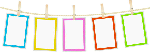 photo frames hanging on a rope with clothespins. vector photo frames hanging on a rope with clothespins. vector clothespin photos stock illustrations