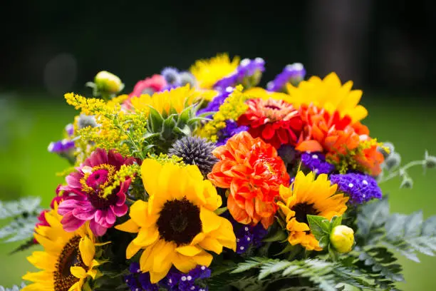 Colorful bouquet with sunflowers in the garden