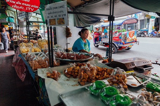 Bangkok, Thailand - September 09, 2011: Vendor cooking food on the street on September 09, 2011 in Bangkok, Thailand