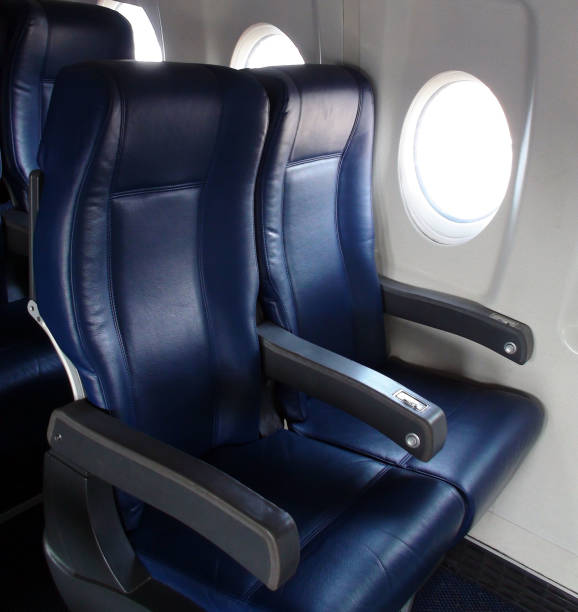 istock Interior Of Passengers Airplane With Empty Seats View At Airport Loading,Unloading Gate 816284018