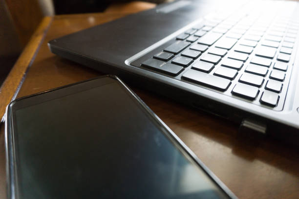istock close up mobile with laptop 816286826