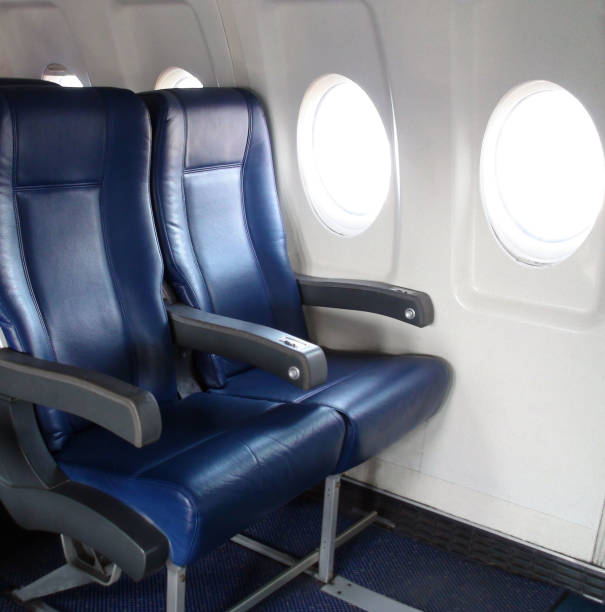 istock Interior Of Passengers Airplane With Empty Seats Scene At Airport Loading,Unloading Gate 816286856