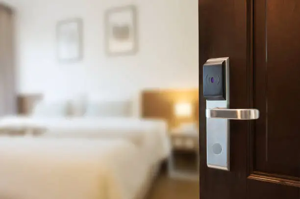 Open the door using a keycard system.